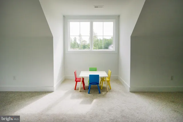 a bedroom with a bed and a table