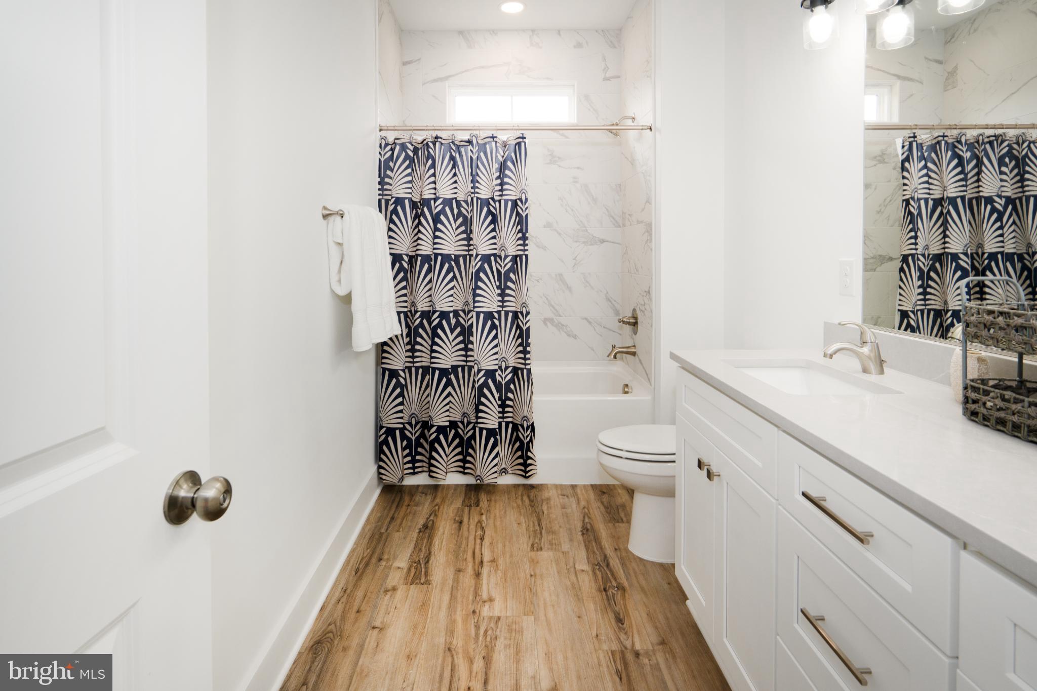 723 Rainbow Ridge Bumpass, VA 23024 - Photo 34 of 60 a bathroom with a sink a toilet and shower
