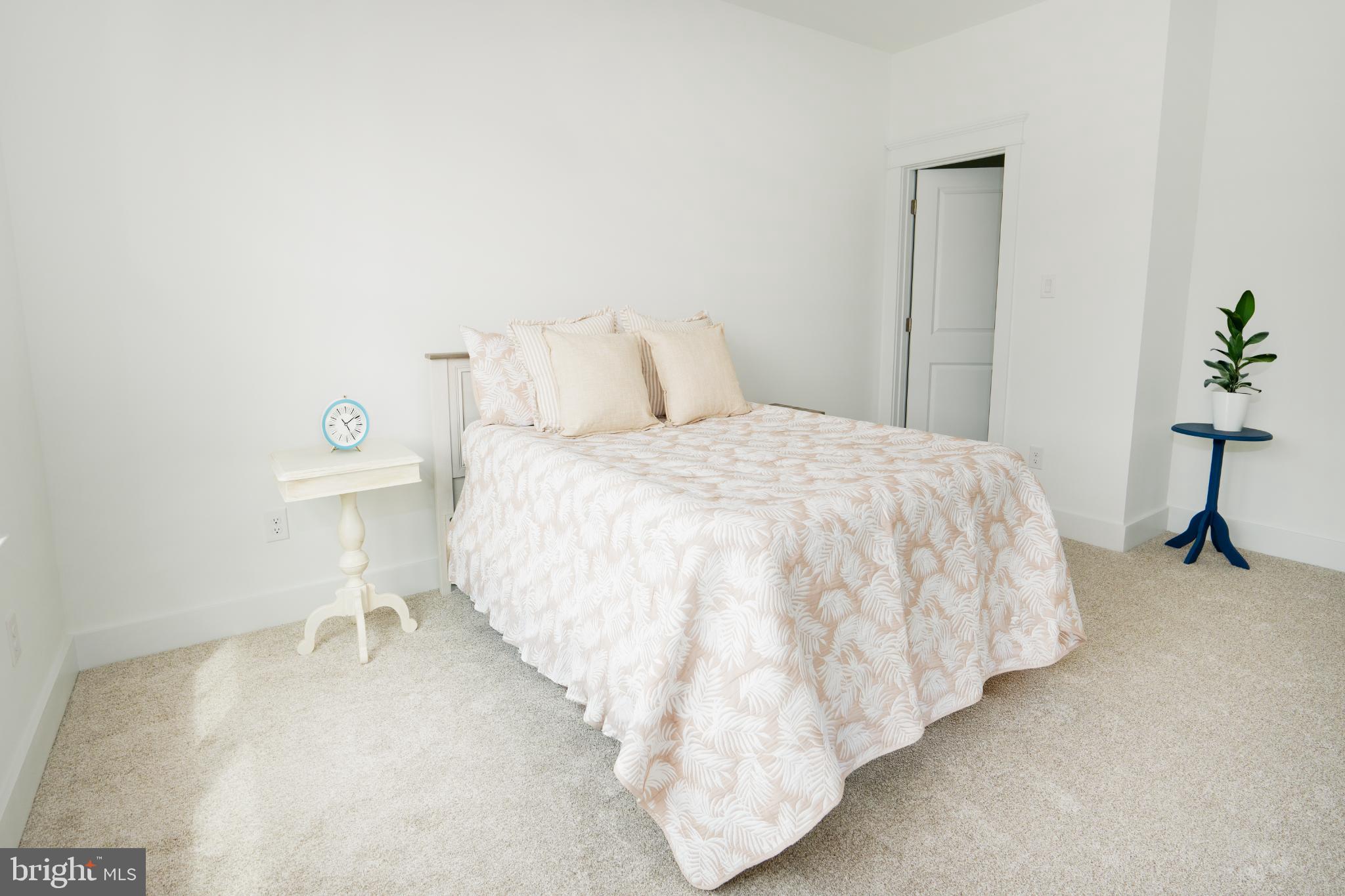 723 Rainbow Ridge Bumpass, VA 23024 - Photo 36 of 60 a bedroom with a bed and a table