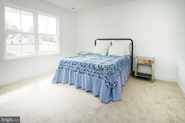 a view of a house with a door and a yard