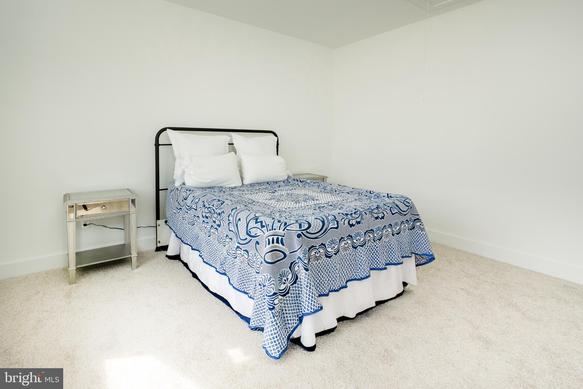 723 Rainbow Ridge Bumpass, VA 23024 - Photo 38 of 60 a bedroom with a bed and a chair