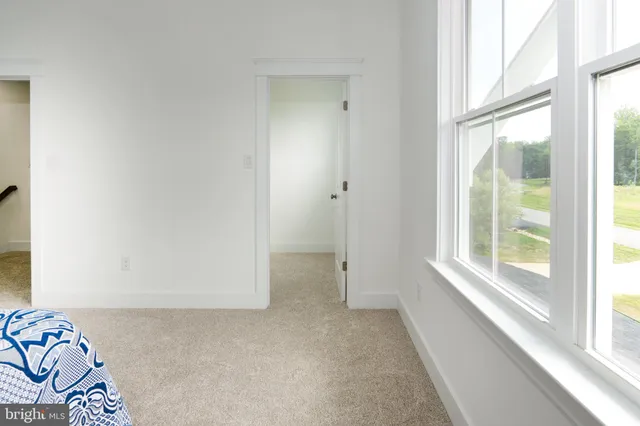 a view of a house with backyard and porch