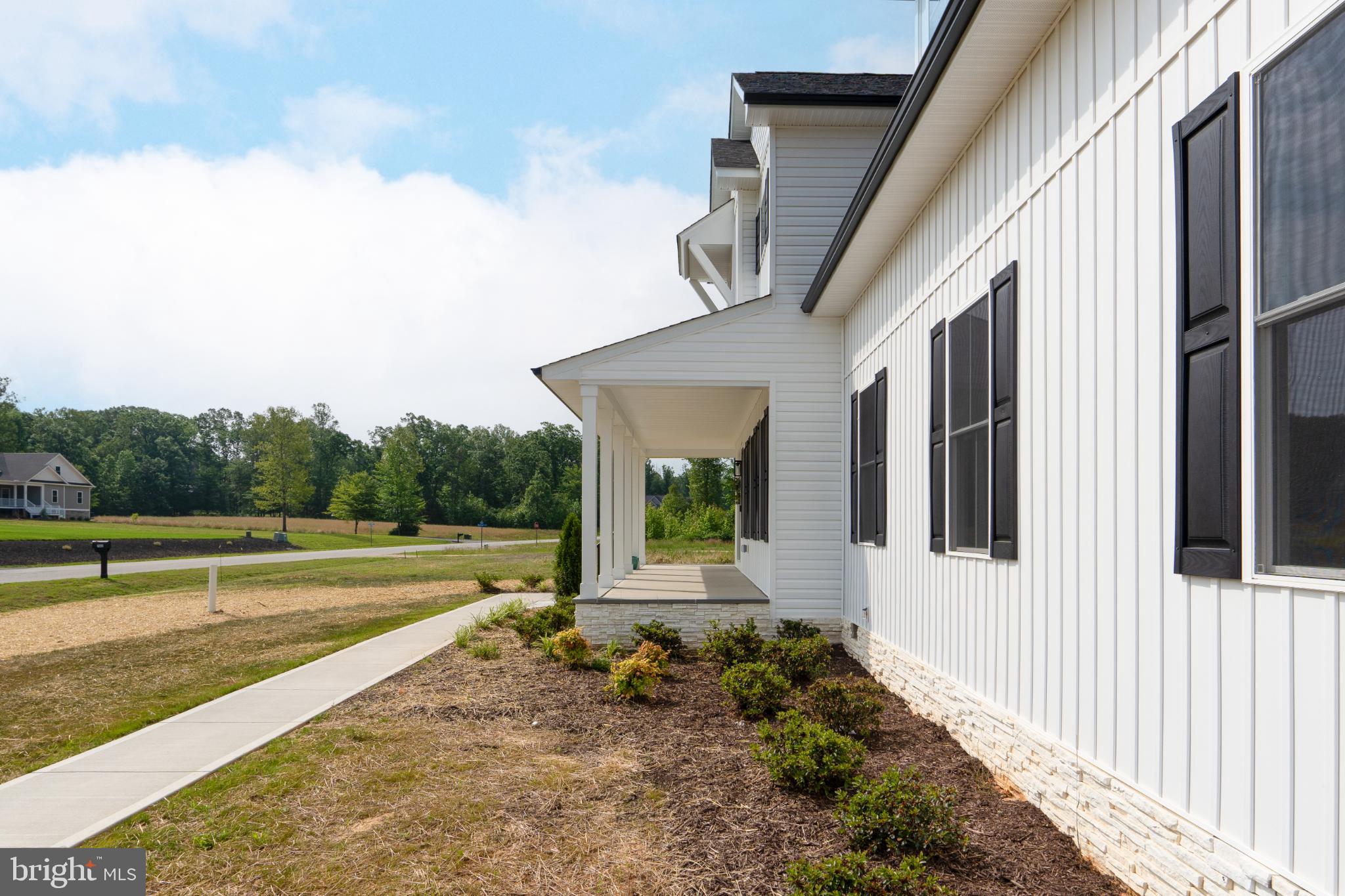 723 Rainbow Ridge Bumpass, VA 23024 - Photo 46 of 60 a view of a house with backyard and porch