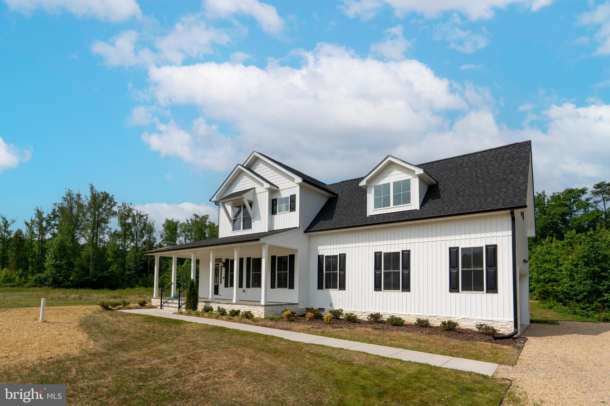 723 Rainbow Ridge Bumpass, VA 23024 - Photo 47 of 60 a front view of a house with a yard