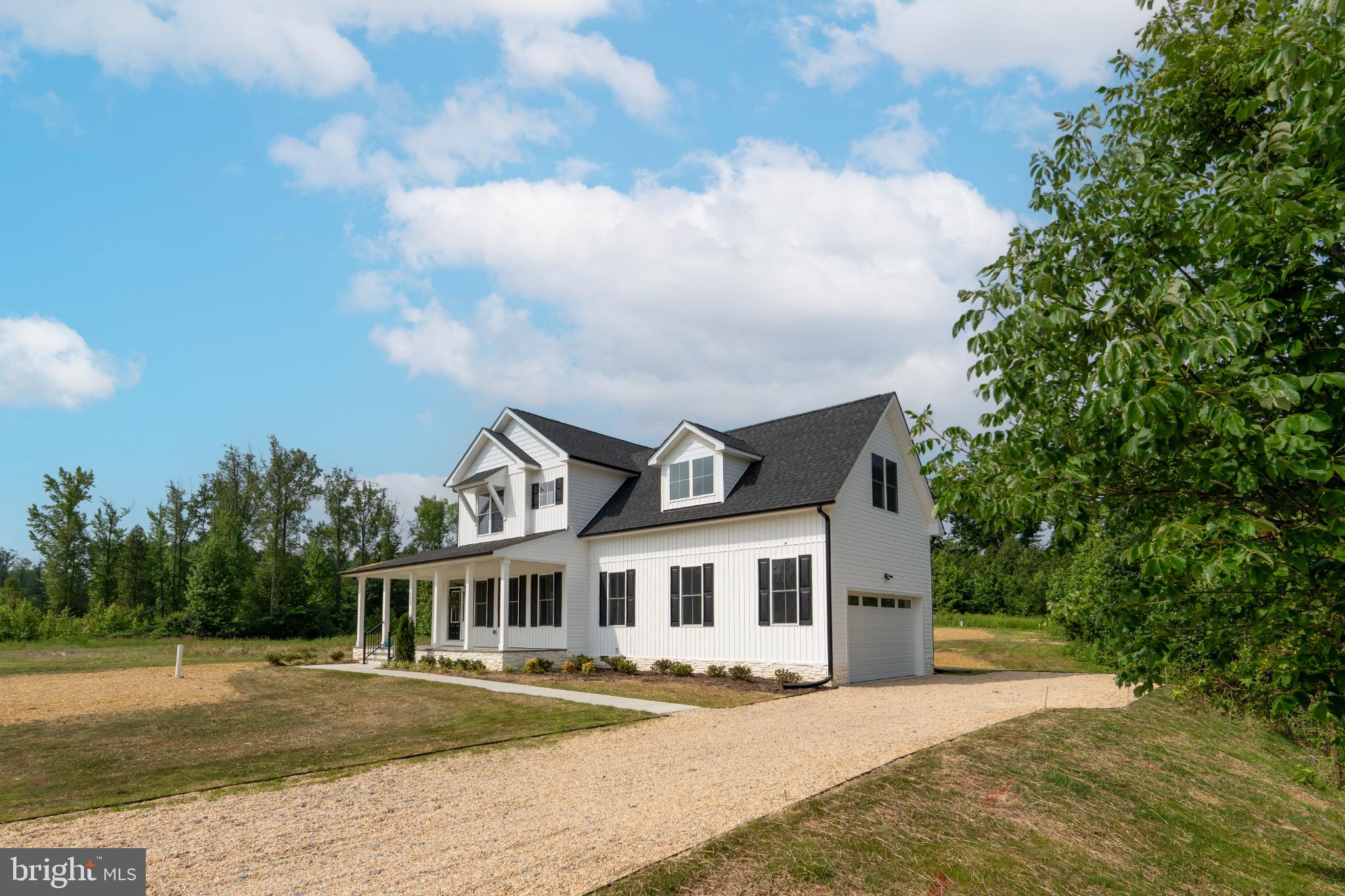 723 Rainbow Ridge Bumpass, VA 23024 - Photo 6 of 60 a front view of a house with a garden