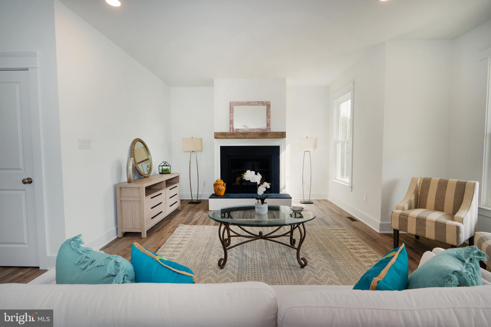 723 Rainbow Ridge Bumpass, VA 23024 - Photo 10 of 60 a living room with furniture and a fireplace