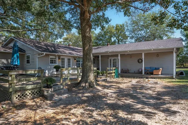 a front view of house with outdoor seating