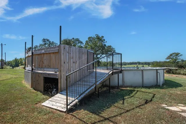 a view of a backyard with sitting area