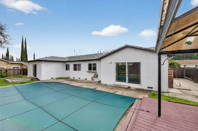 a front view of a house with yard patio and seating area