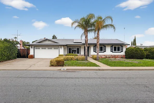 a house view with a garden space