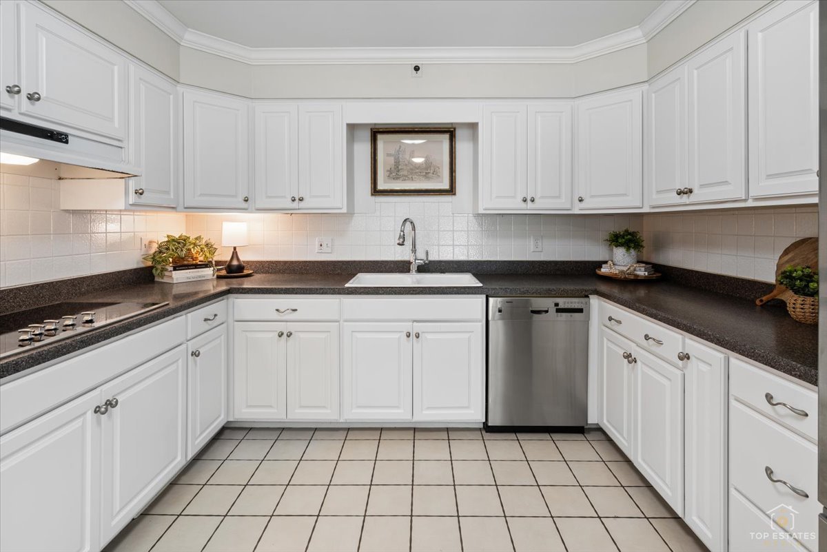 326 Charles Street Geneva, IL 60134 - Photo 11 of 33 a kitchen with cabinets appliances a sink and a stove