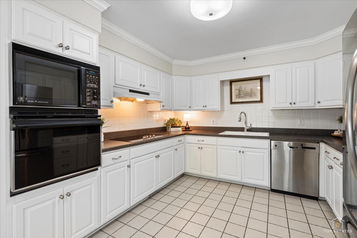 326 Charles Street Geneva, IL 60134 - Photo 12 of 33 a kitchen with granite countertop cabinets stainless steel appliances and a sink