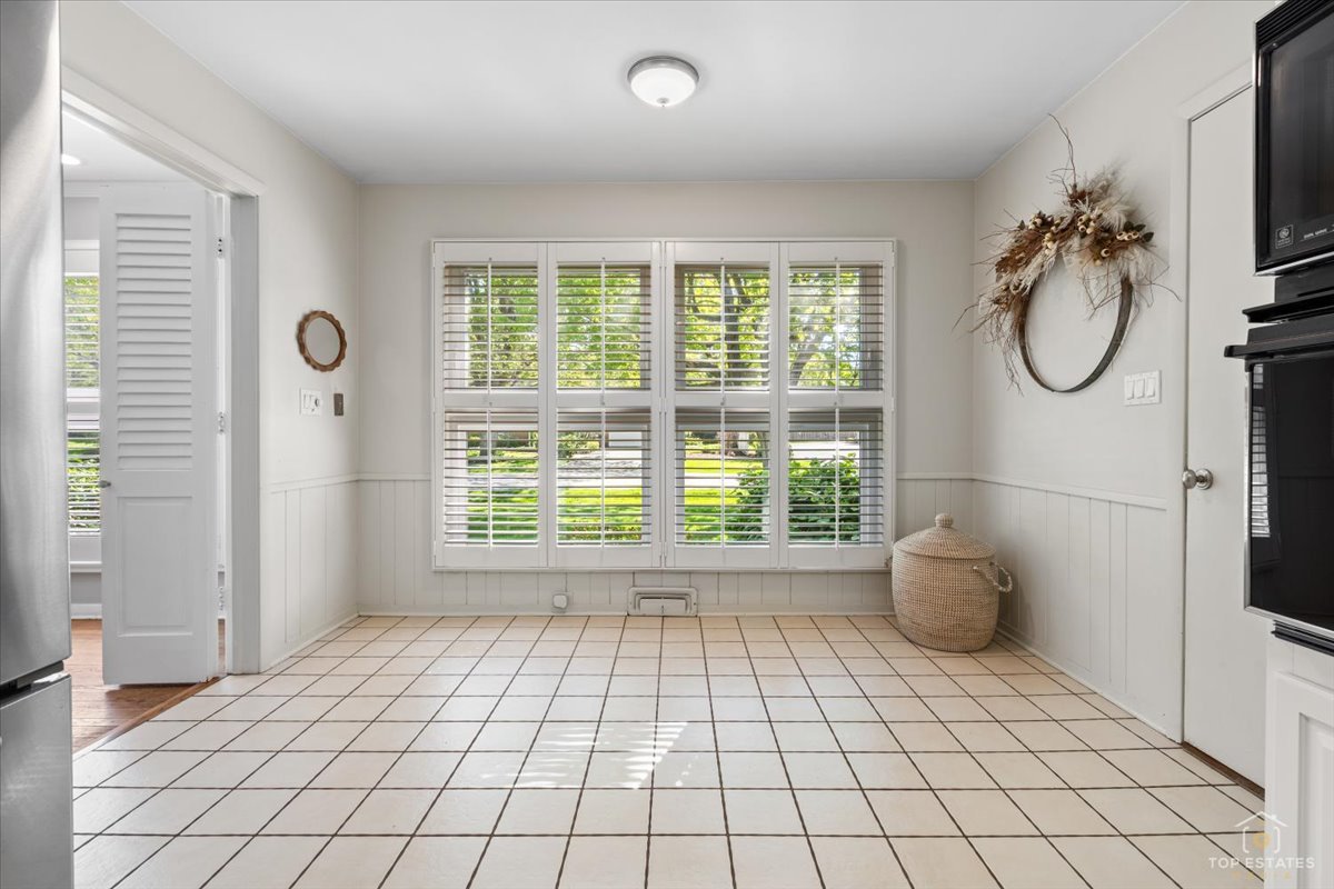 326 Charles Street Geneva, IL 60134 - Photo 13 of 33 a view of a bathroom with a shower and a window
