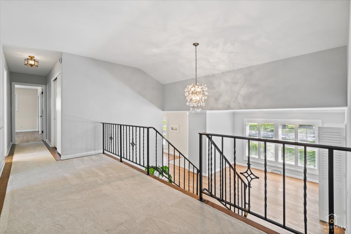 326 Charles Street Geneva, IL 60134 - Photo 14 of 33 a view of empty room with stairs and chandelier