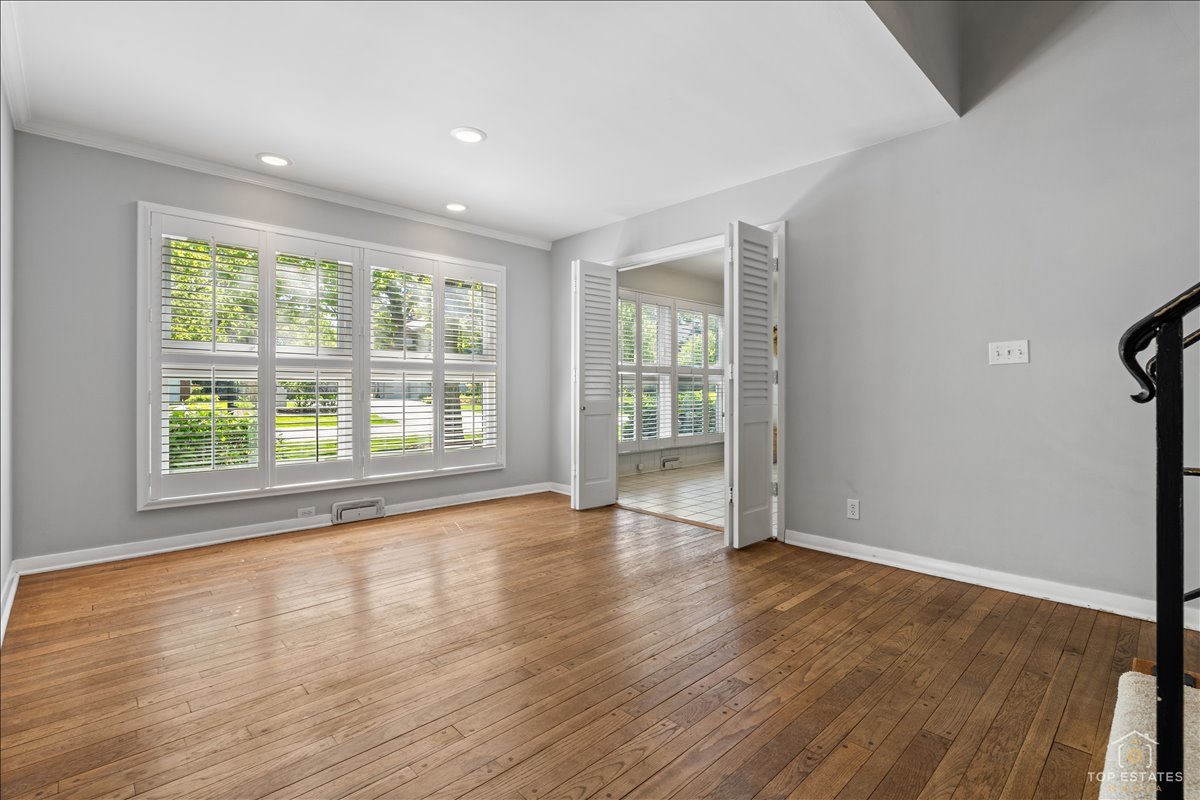 326 Charles Street Geneva, IL 60134 - Photo 8 of 33 an empty room with wooden floor and windows