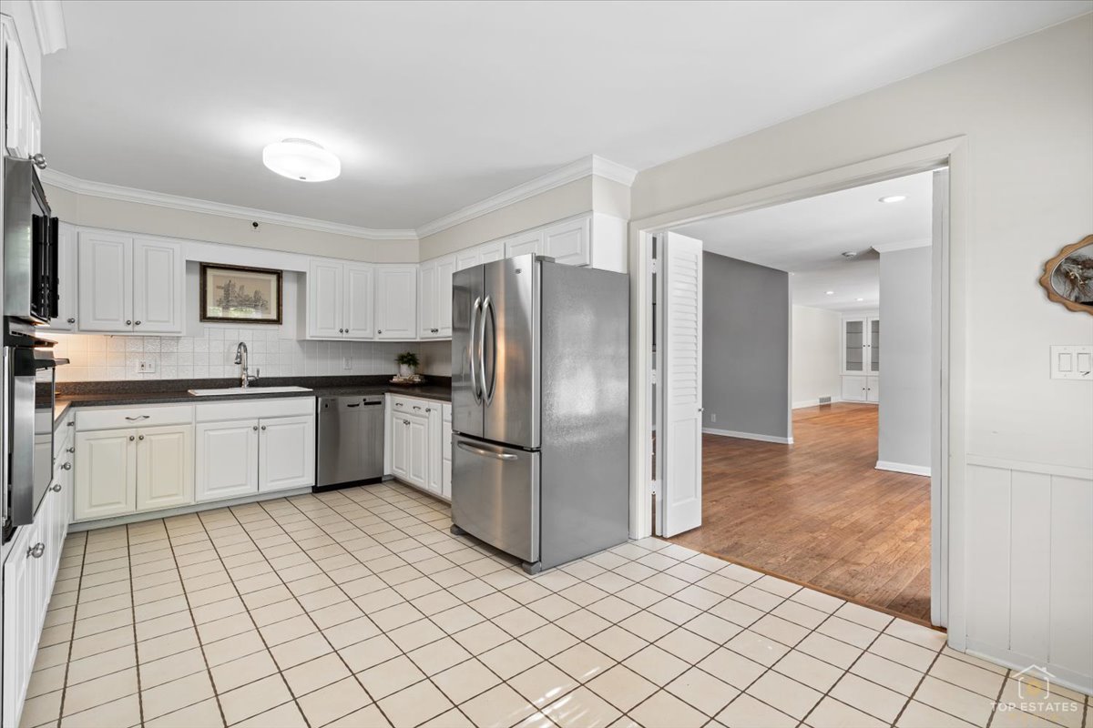 326 Charles Street Geneva, IL 60134 - Photo 10 of 33 a kitchen with stainless steel appliances a refrigerator sink and cabinets