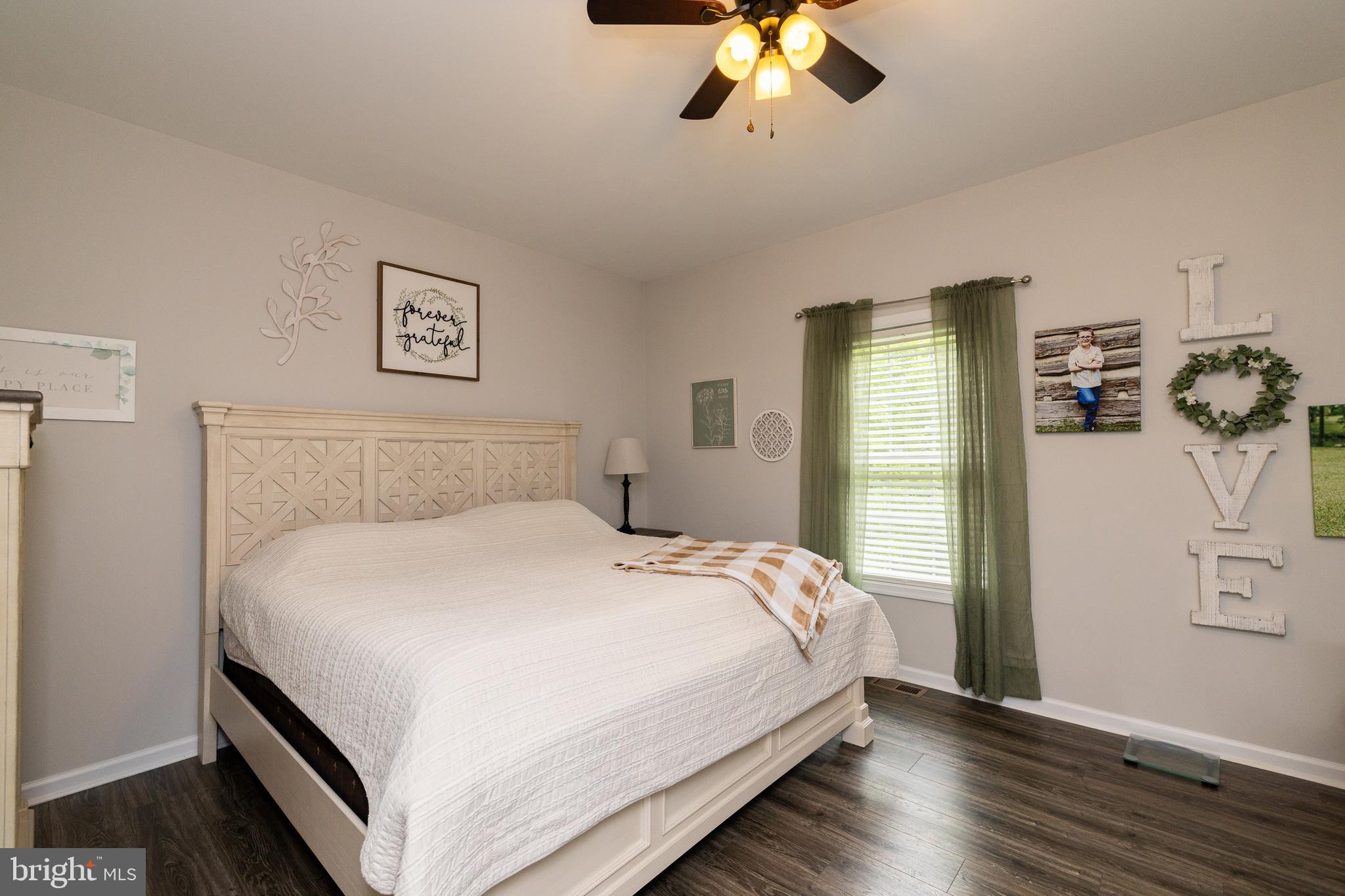 33 Sinker Drive Inwood, WV 25428 - Photo 14 of 31 a bedroom with a bed and wooden floor