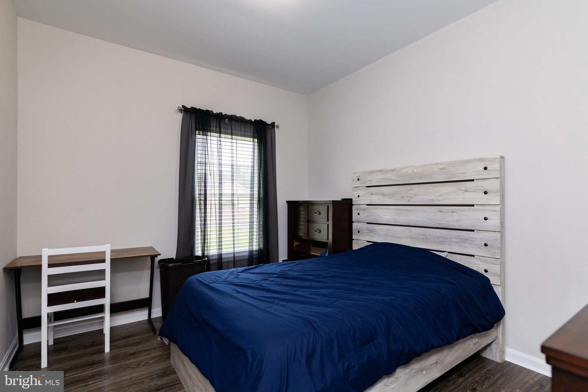 33 Sinker Drive Inwood, WV 25428 - Photo 21 of 31 a bedroom with a bed and a window