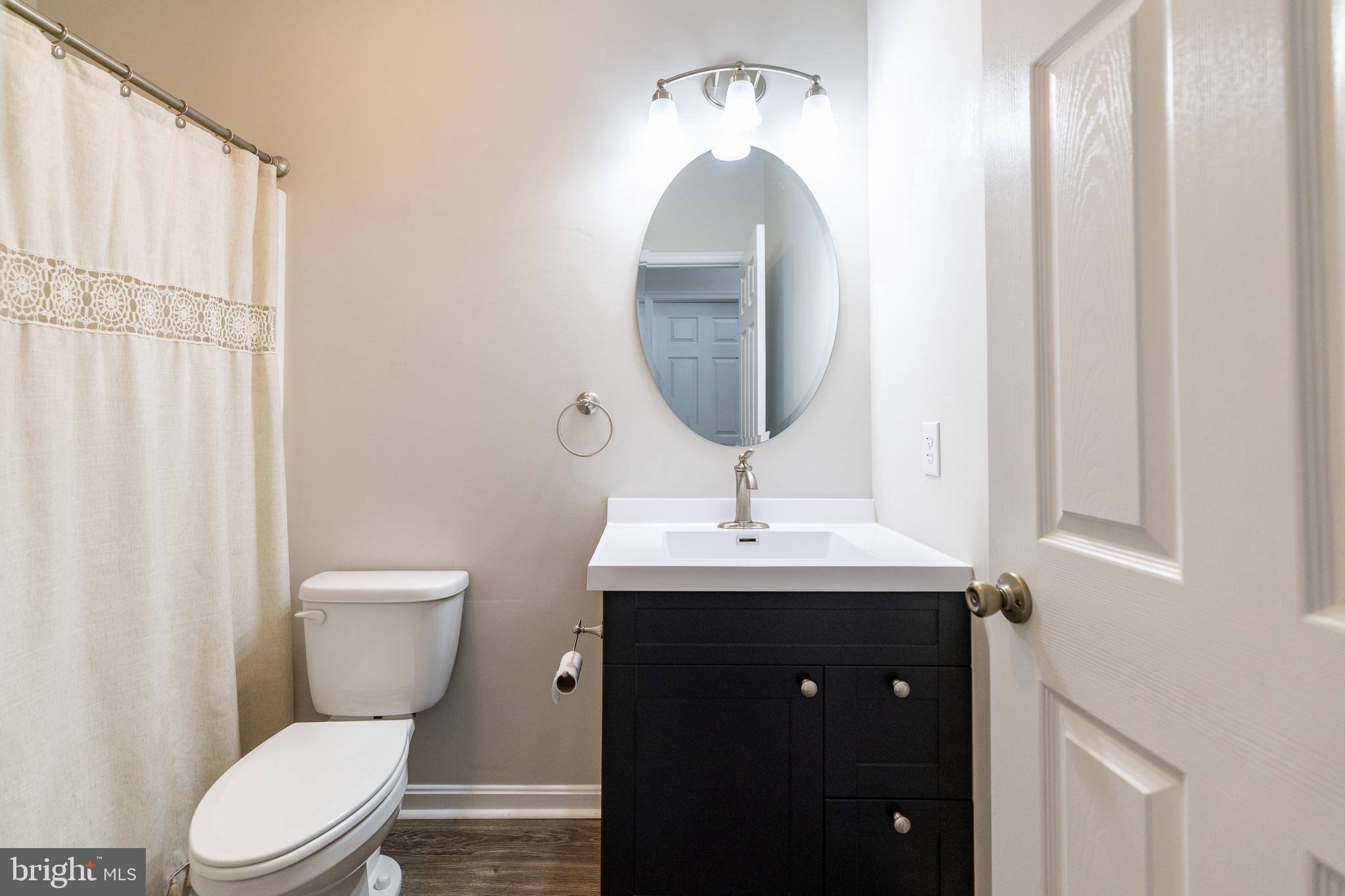 33 Sinker Drive Inwood, WV 25428 - Photo 23 of 31 a bathroom with a toilet sink and mirror