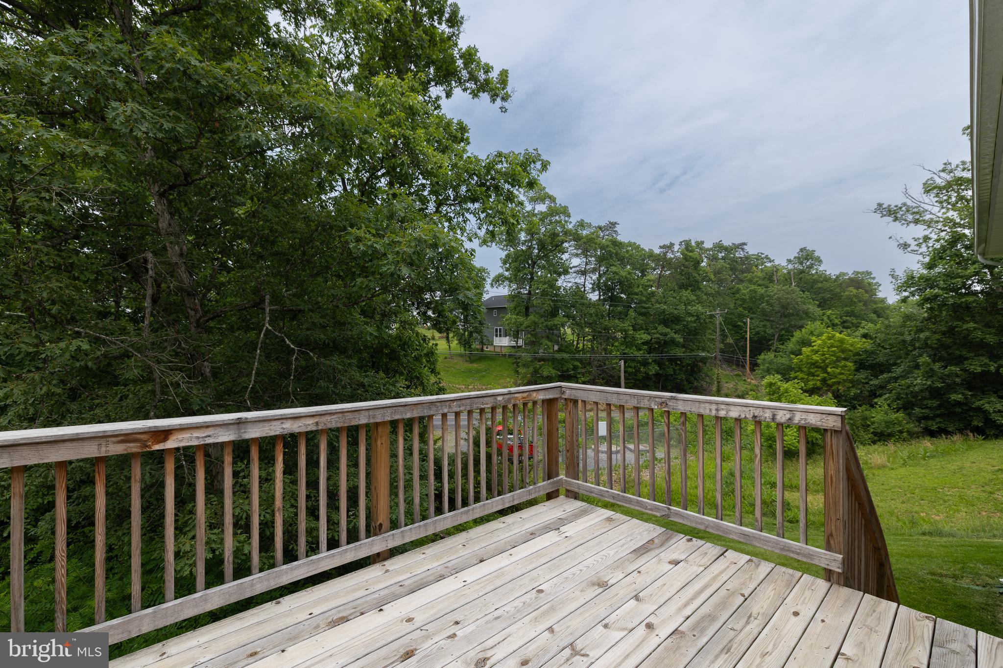 33 Sinker Drive Inwood, WV 25428 - Photo 28 of 31 a view of balcony with wooden floor and yard