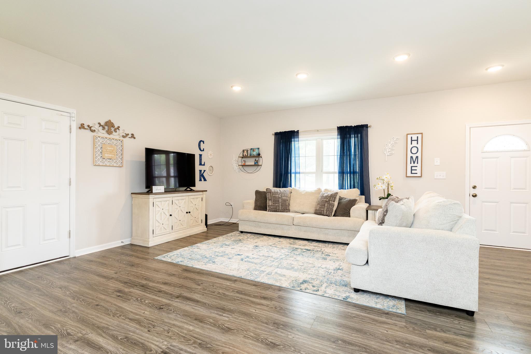 33 Sinker Drive Inwood, WV 25428 - Photo 5 of 31 a living room with furniture and a flat screen tv