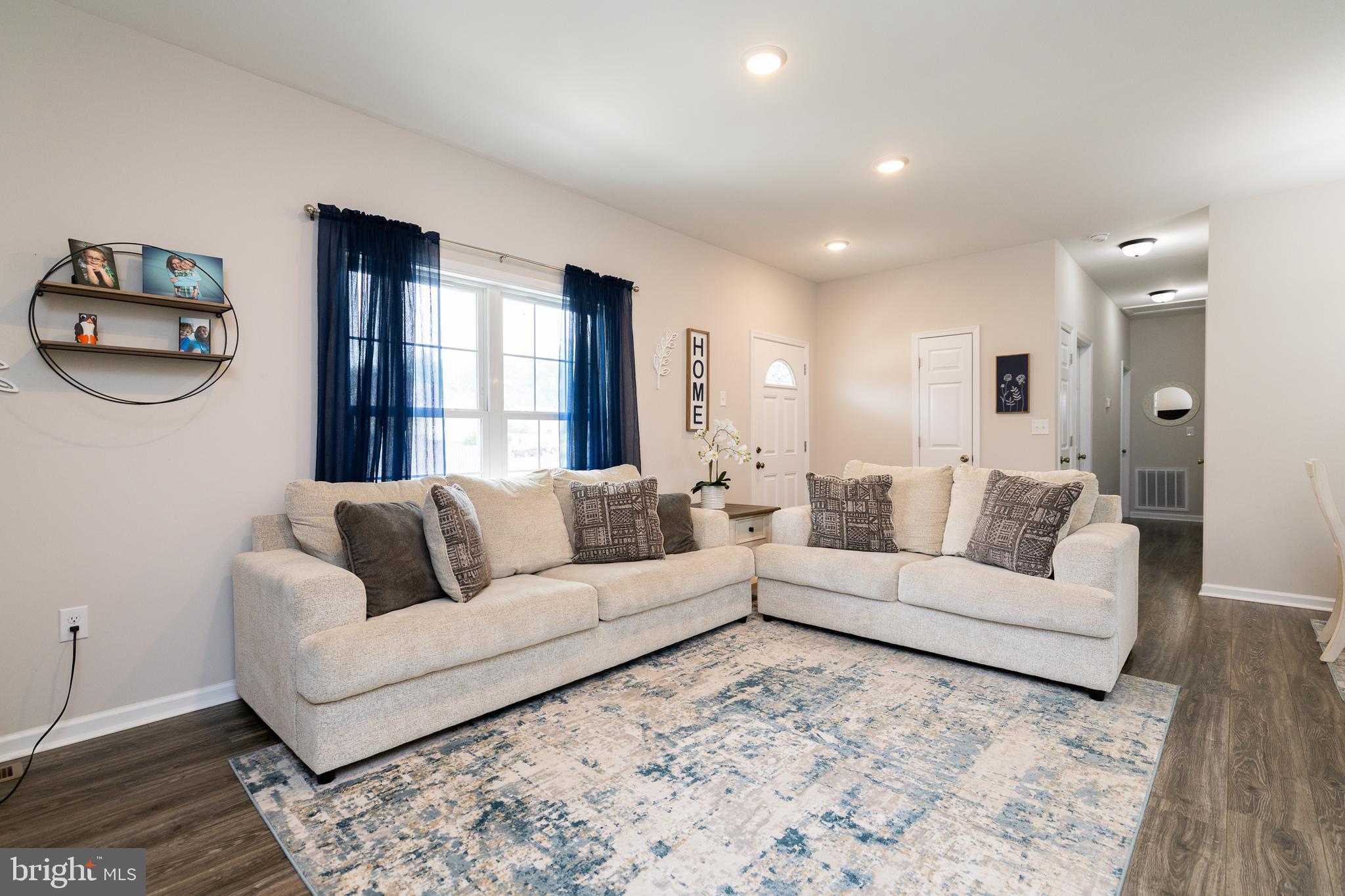 33 Sinker Drive Inwood, WV 25428 - Photo 7 of 31 a living room with a couch and a window