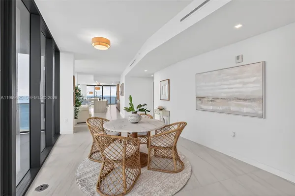 a bathroom with a granite countertop sink toilet a mirror and shower