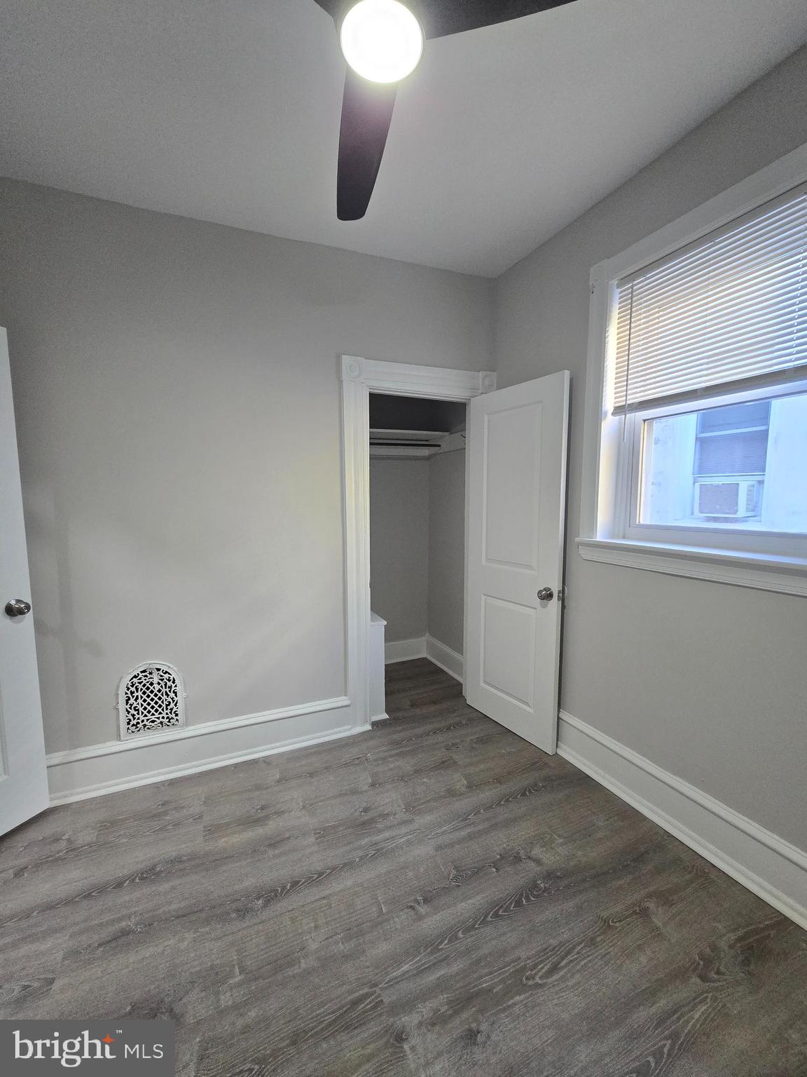 5211 Ridge Avenue, Unit 2 Philadelphia, PA 19128 - Photo 11 of 23 a view of an empty room with wooden floor and a window