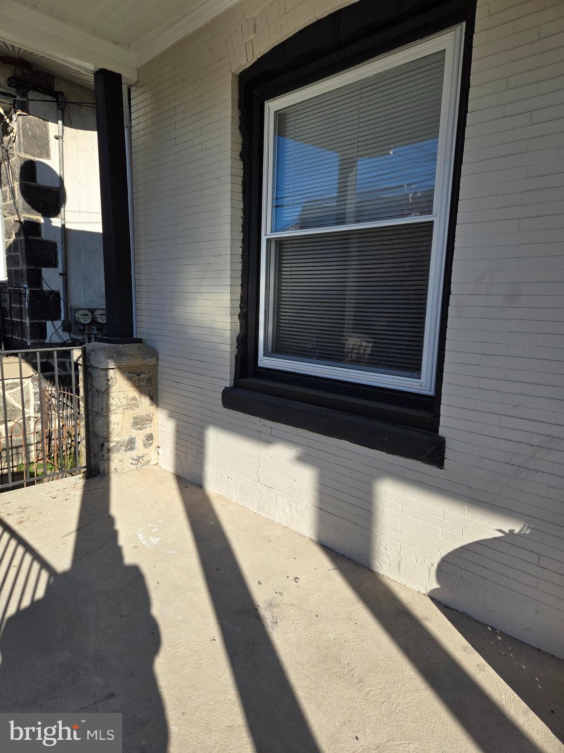 5211 Ridge Avenue, Unit 2 Philadelphia, PA 19128 - Photo 19 of 23 a living room with a fireplace and a flat screen tv