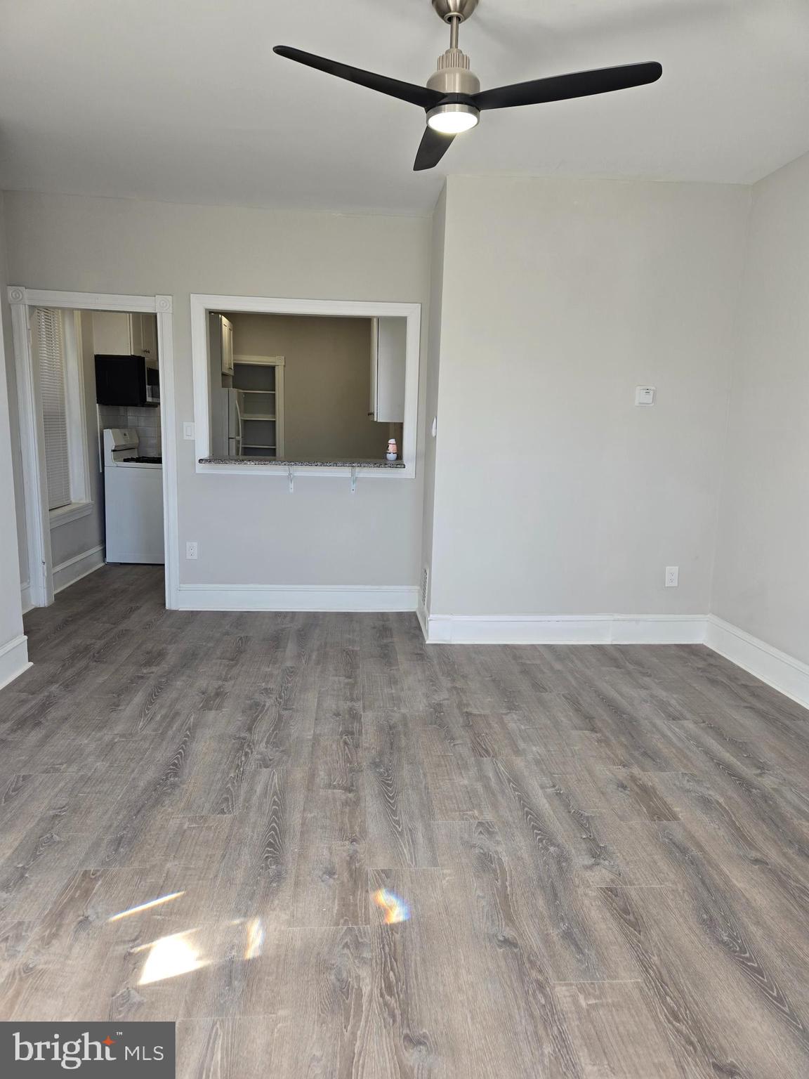 5211 Ridge Avenue, Unit 2 Philadelphia, PA 19128 - Photo 5 of 23 a view of empty room with wooden floor and fan