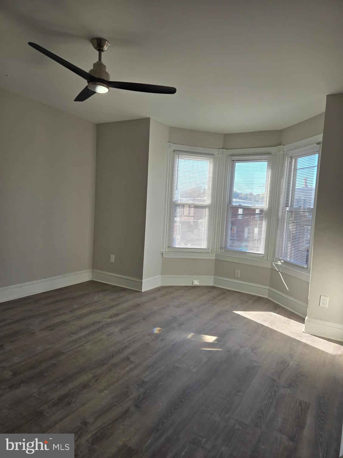 5211 Ridge Avenue, Unit 2 Philadelphia, PA 19128 - Photo 6 of 23 a view of livingroom with hardwood floor and window
