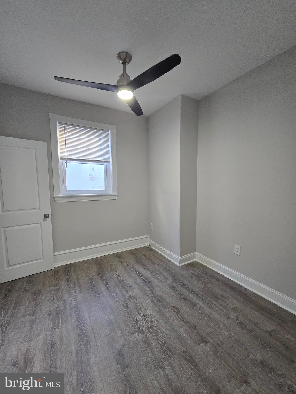 5211 Ridge Avenue, Unit 2 Philadelphia, PA 19128 - Photo 10 of 23 an empty room with wooden floor and windows