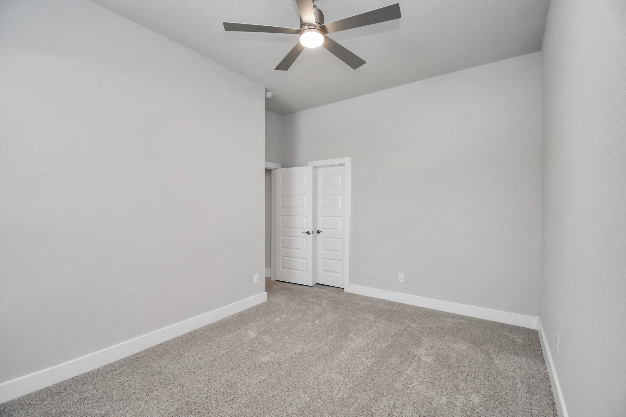 3031 Native Spg Drive Spring, TX 77373 - Photo 27 of 30 Generously sized secondary bedrooms featuring spacious closets, soft and inviting carpeting underfoot, large windows allowing plenty of natural light, and the added touch of privacy blinds for your personal retreat. Sample photo of completed home with similar floor plan. Actual colors and selections may vary.