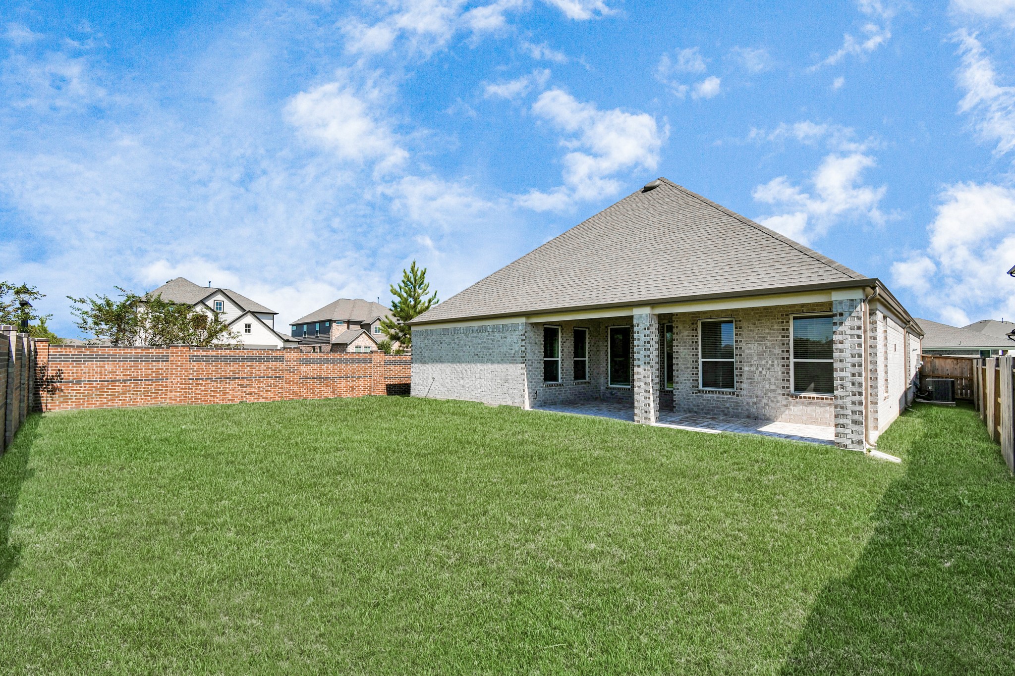 3031 Native Spg Drive Spring, TX 77373 - Photo 30 of 30 Explore the expansive backyard with its inviting covered patio—a perfect blend of space for the kids to play and adults to unwind. Ideal for creating your outdoor oasis, this backyard accommodates patio furniture, a BBQ pit, and endless possibilities for leisure and entertainment. Sample photo of completed home with similar floor plan. Actual colors and selections may vary.