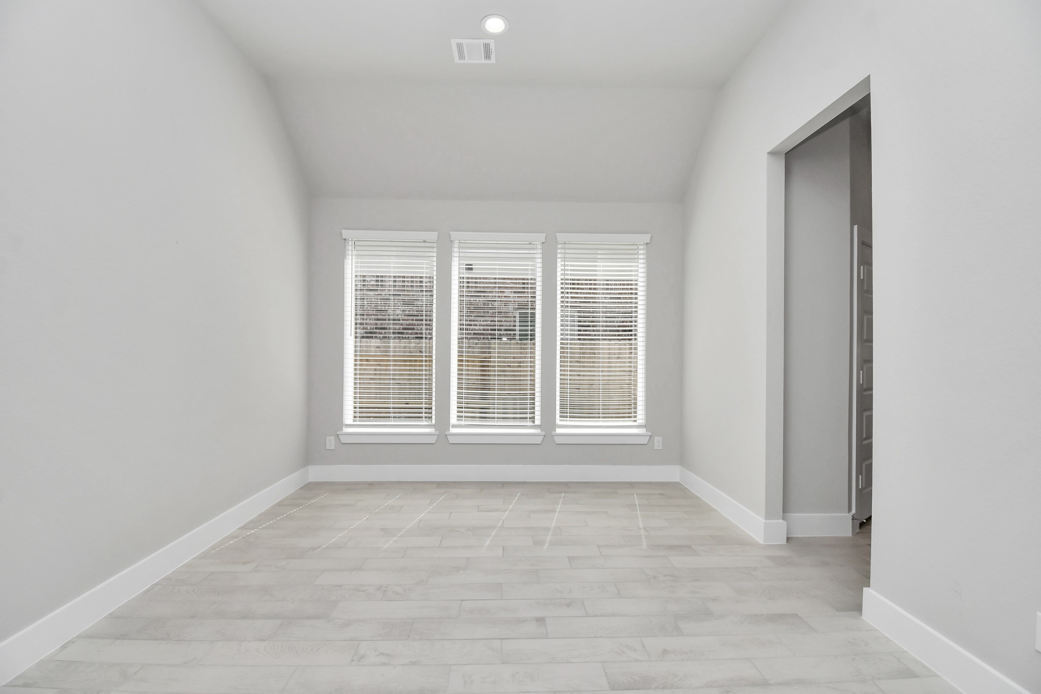 3031 Native Spg Drive Spring, TX 77373 - Photo 3 of 30 Create lasting memories with your family and friends at the dining table! This expansive dining room showcases sophisticated flooring, custom paint, and seamlessly connects to the family room and kitchen, providing an open and inviting atmosphere. Sample photo of completed home with similar floor plan. Actual colors and selections may vary.