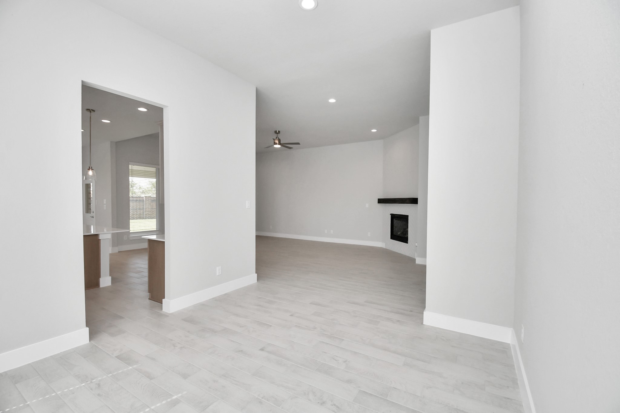 3031 Native Spg Drive Spring, TX 77373 - Photo 4 of 30 Make memories gathered around the table with your family and friends! This spacious dining room features elegant flooring, custom paint, and adjacent to family room and kitchen for open concept feel. Sample photo of completed home with similar floor plan. Actual colors and selections may vary.