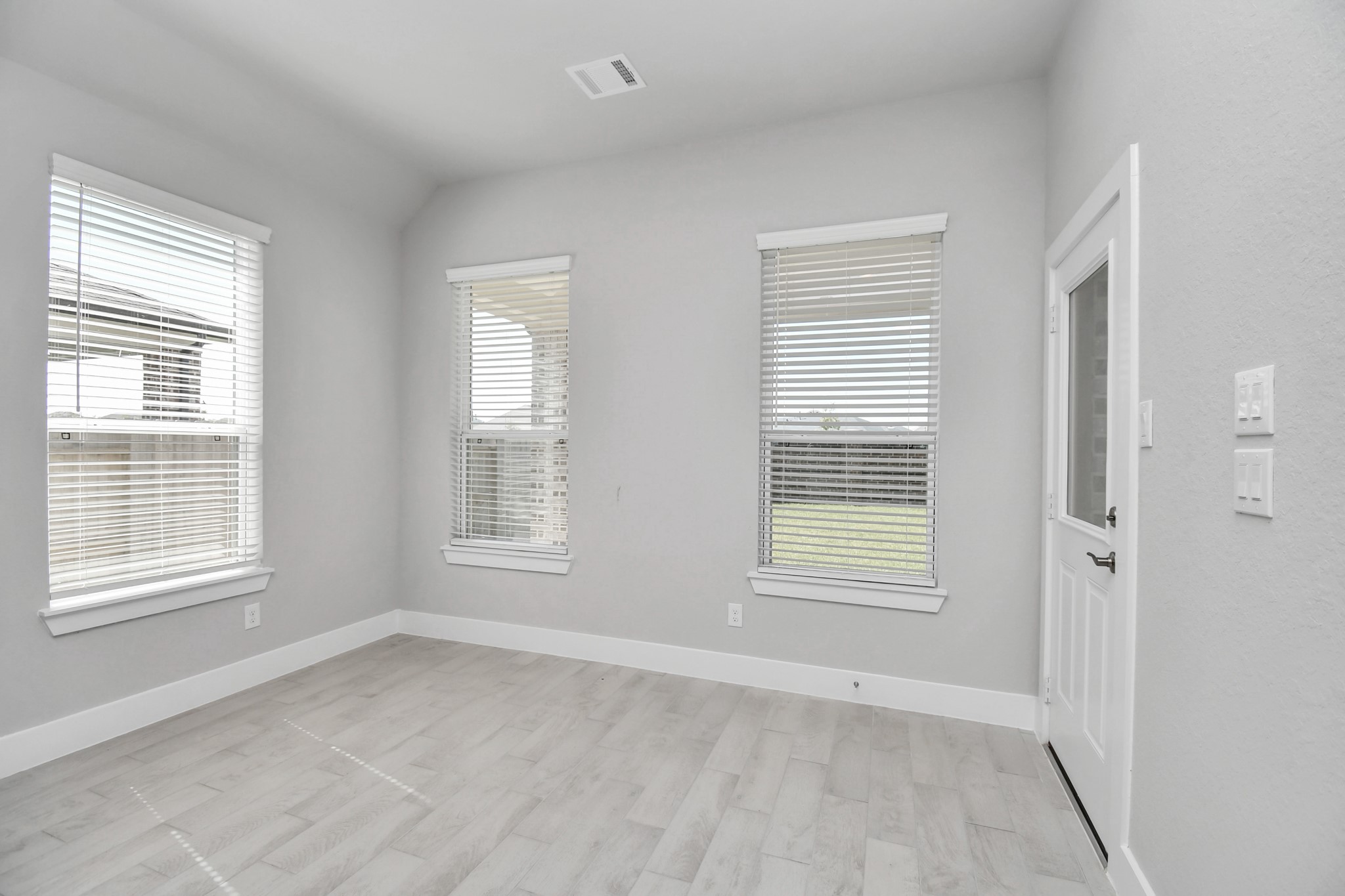 3031 Native Spg Drive Spring, TX 77373 - Photo 10 of 30 Enjoy breakfast with ease in the connected and cozy breakfast area, seamlessly integrated with the kitchen for utmost convenience. Step through the back door for a breath of fresh air onto the covered patio, extending your living space to the outdoors. Sample photo of completed home with similar floor plan. Actual colors and selections may vary.