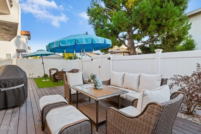 a view of a patio in the backyard