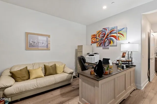 a living room with granite countertop furniture and painting on the wall