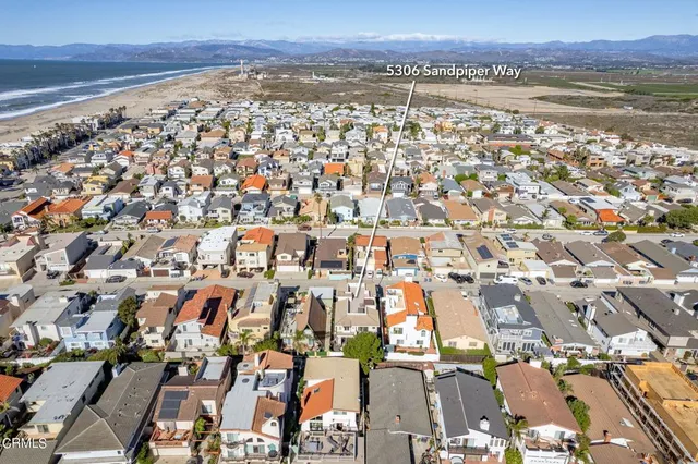 an aerial view of residential building and lake