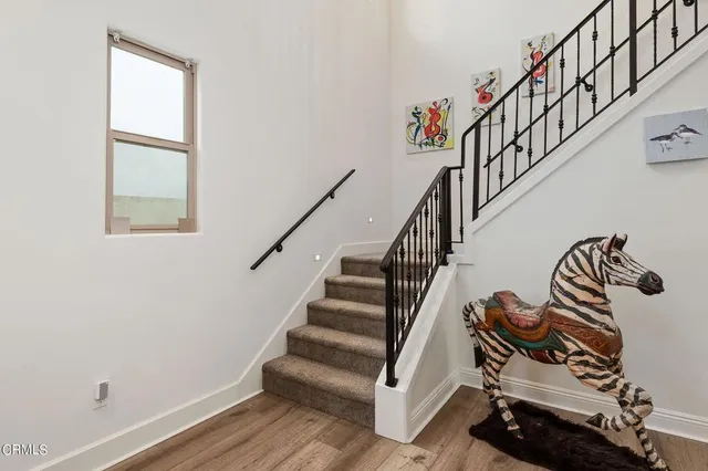 a view of entryway with wooden floor