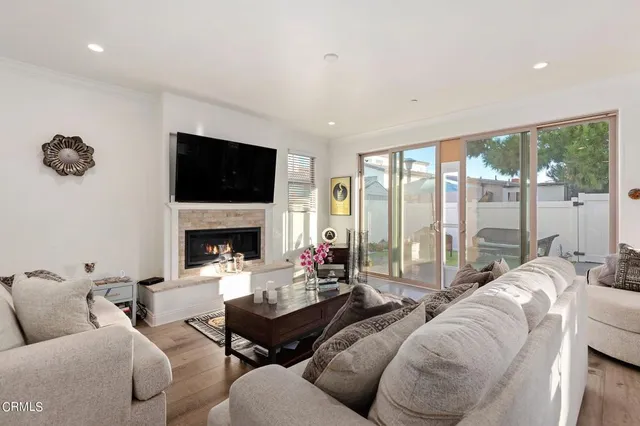 a living room with furniture fireplace and a flat screen tv