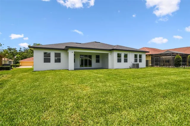 an aerial view of a house with a garden