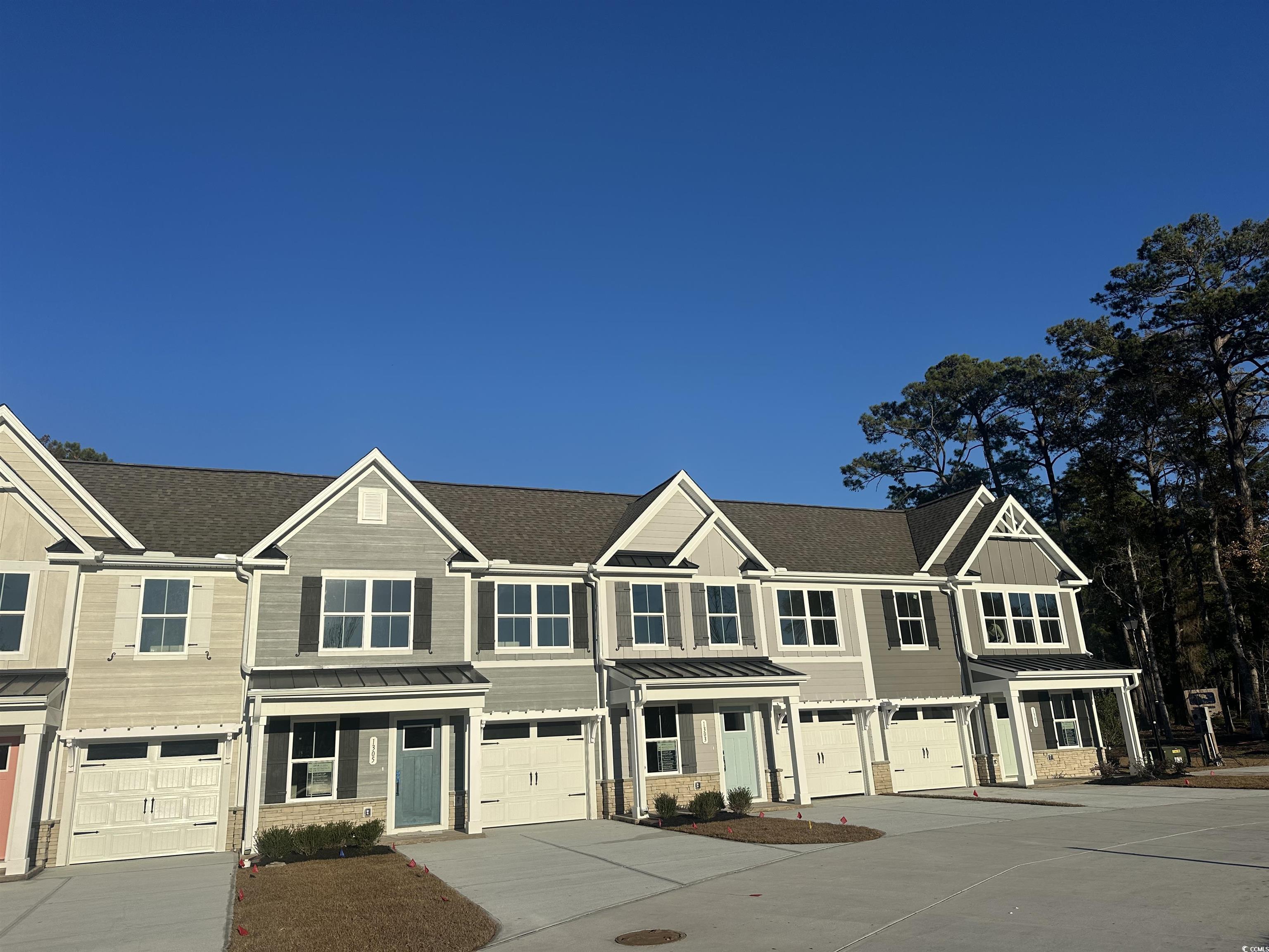 1433 Pleasant View Drive, Unit E North Myrtle Beach, SC 29582 - Photo 2 of 40 Craftsman inspired home featuring driveway, a standing seam roof, a metal roof, and a garage