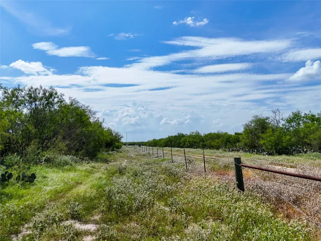 a view of lake with a yard