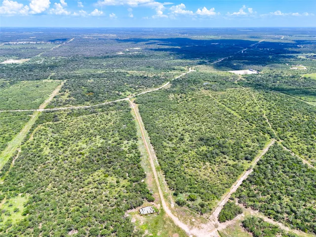 a view of a yard with an ocean view