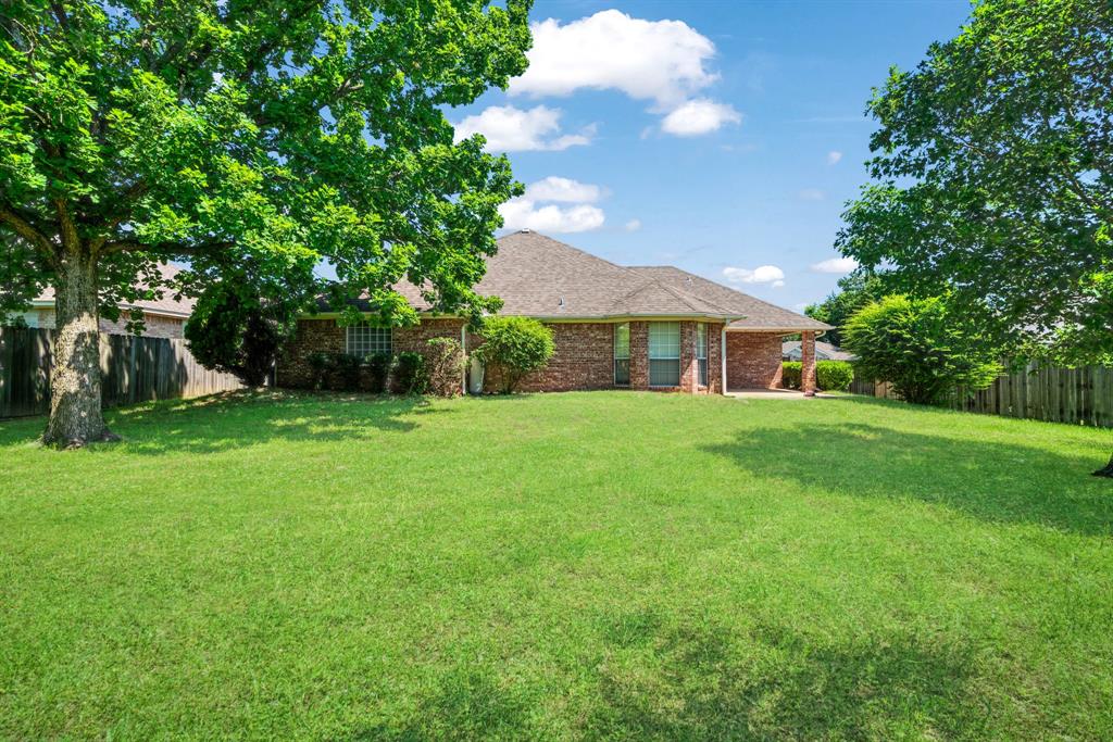 3750 Castlegate Drive Paris, TX 75462 - Photo 20 of 20 a view of house that has a yard