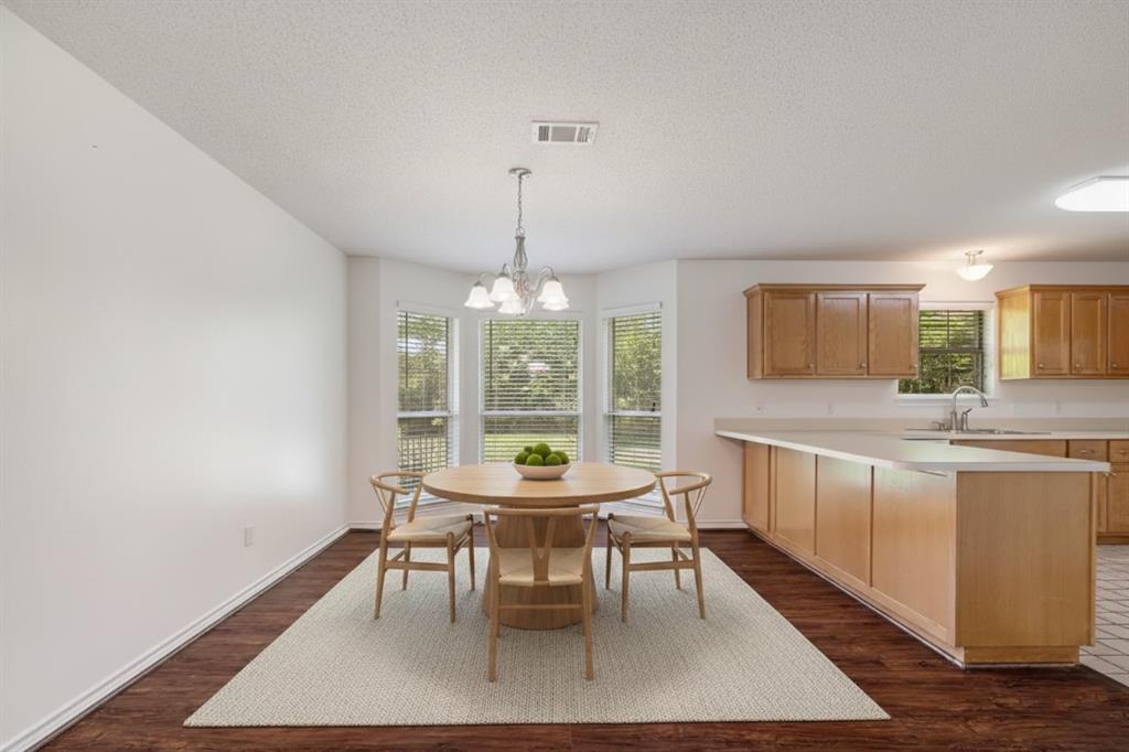 3750 Castlegate Drive Paris, TX 75462 - Photo 8 of 20 a view of a dining room with furniture window and wooden floor