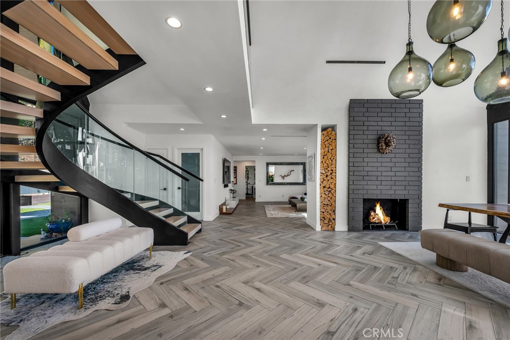 24301 Sylvan Glen Road Calabasas, CA 91302 - Photo 13 of 64 a living room with furniture and a fireplace