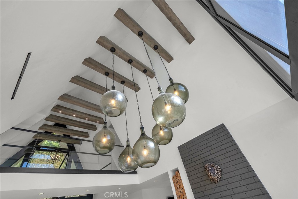 24301 Sylvan Glen Road Calabasas, CA 91302 - Photo 19 of 64 a view of living room with furniture and chandelier